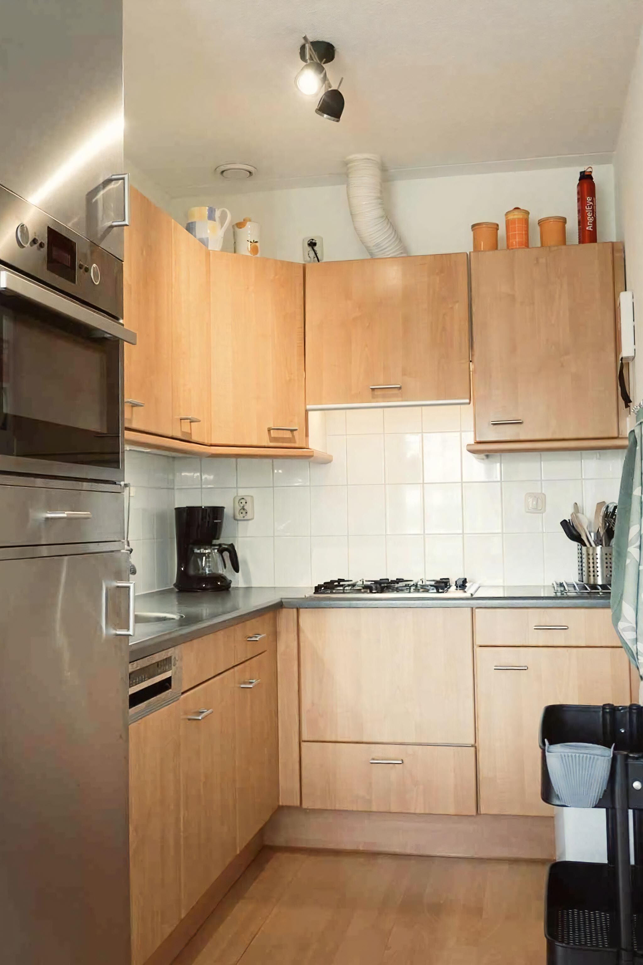 Oven, dishwasher, toaster, dining tables