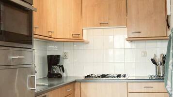 Oven, dishwasher, toaster, dining tables