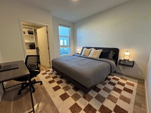 1 bedroom, desk, iron/ironing board, travel crib