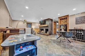 TV, fireplace, books, offices