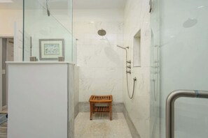 Shower, hair dryer, towels, shampoo