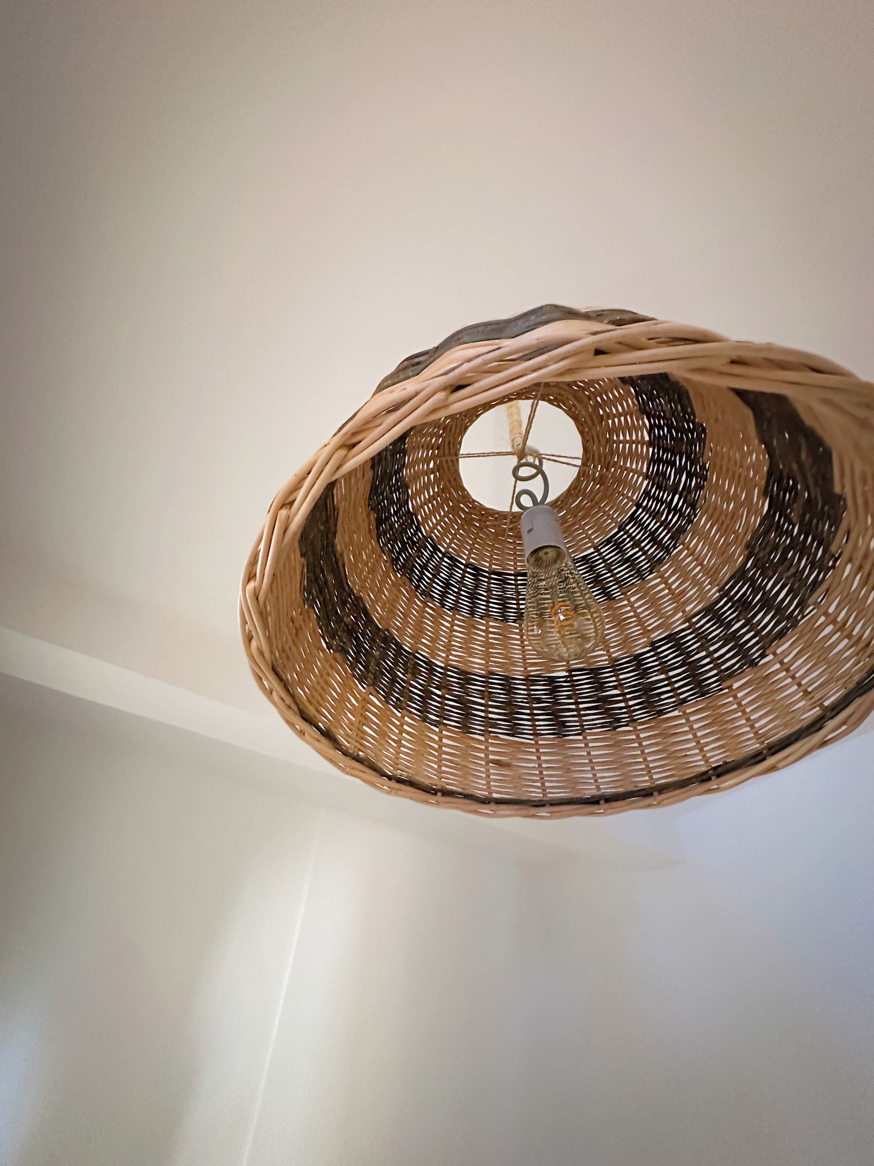 A woven basket ceiling light fixture.