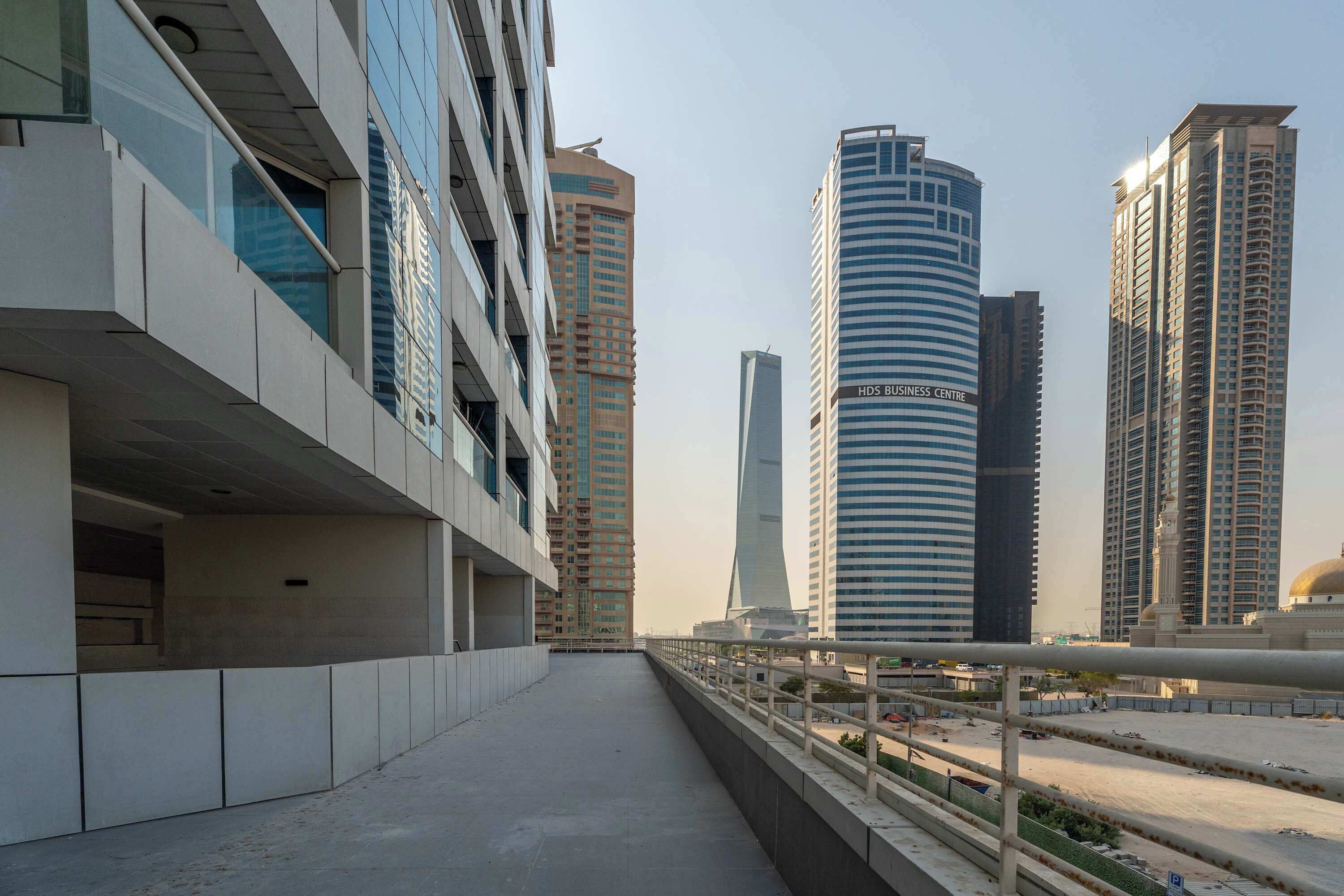A modern urban area with high-rise buildings, including a prominent HDS Business Centre.