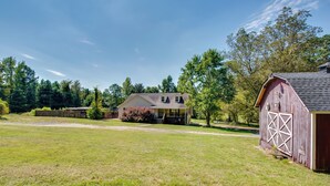 A rural property with a large house, a barn, and a well-maintained lawn. - Near Trails & Live Music: Cozy Atlanta Apt! (Atlanta)