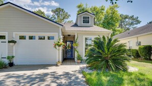 A single-story house with a garage, a front door, and a small attached garage. - Golf Course Community Home Near Springs & Swimming (Alachua)