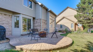 A patio with outdoor furniture, a grill, and a brick fire pit. - Macomb Retreat w/ Spacious Yard & Fire Pit (Macomb)