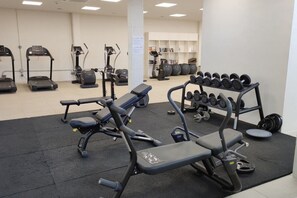 A gym with exercise equipment including treadmills, ellipticals, and weight machines. - Amazing seaview near the beach! (La Cala de Mijas)