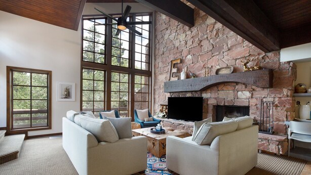 A cozy living room with two sofas, a fireplace, and large windows. - Stag Lodge at Deer Valley Resort - Three Bedroom Residence with Spa #9 3 Condo (Park City)