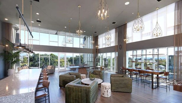 A spacious, modern kitchen with a long island counter, bar seating, and a view of the outdoors. - Elegant Escape 10 Min From Disneyland With Pool GYM (Santa Ana)