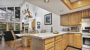 A spacious kitchen with wooden cabinets, a granite countertop, and modern appliances. - Aspenwood at Deer Valley Resort - Three Bedroom Condo with Hot Tub #1305 3 Condo (Park City)