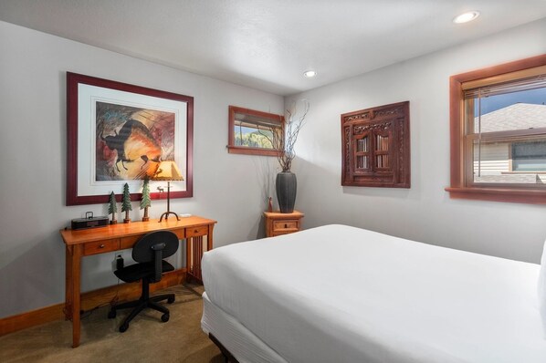 A hotel room with a bed, desk, chair, framed artwork, and a window. - Greyhawk at Deer Valley Resort - Two Bedroom Condo with Hot Tub #12 2 Condo (Park City)