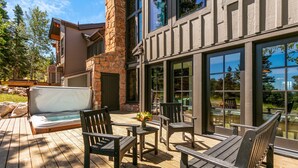 A wooden deck with outdoor seating and a hot tub. - Stag Lodge At Deer Valley Resort - 4 Bed W/ Spa #7 4 Bedroom Condo (Park City)