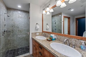 A modern bathroom with two sinks, a shower, and a large mirror. - 305 - Three Bedroom Condo Shooting Star by Deer Valley Resort (Park City)