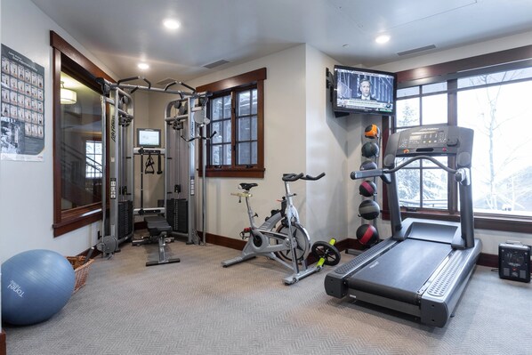 A home gym with a treadmill, stationary bike, and various exercise equipment. - 208 - Three Bedroom Condo Flagstaff by Deer Valley Resort (Park City)