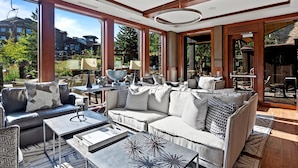A spacious living room with a large window, a sofa set, and a coffee table. - 208 - Three Bedroom Condo Flagstaff by Deer Valley Resort (Park City)