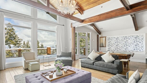 A spacious living room with large windows, a fireplace, and a pool table. - 6977 Silver Lake Drive - 5 Bedroom Private Home with Hot Tub by Deer Valley Resort (Park City)