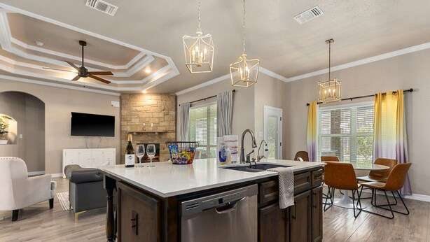 A modern kitchen with a central island, stainless steel appliances, and pendant lighting. - New Heights Home | 8 Bd | 2 mi to Still House Lake Perfect for families & groups (Harker Heights)