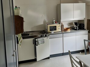 Fridge, microwave, stovetop, coffee/tea maker