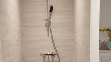 Shower, hair dryer, towels, toilet paper
