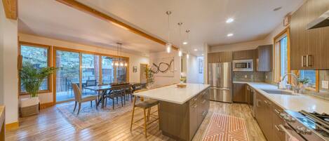 Fridge, stovetop, dishwasher, coffee/tea maker