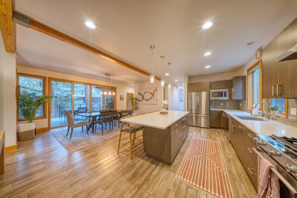 Fridge, stovetop, dishwasher, coffee/tea maker