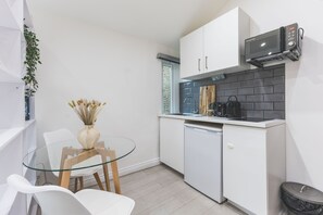 Fridge, microwave, stovetop, coffee/tea maker