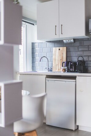 Fridge, microwave, stovetop, coffee/tea maker