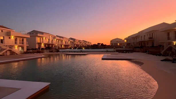 A resort with a swimming pool, connected walkways, and modern buildings. - Apartment 'I Due Mori Marzamemi' with Sea View, Wi-Fi and Air Conditioning (Marzamemi)