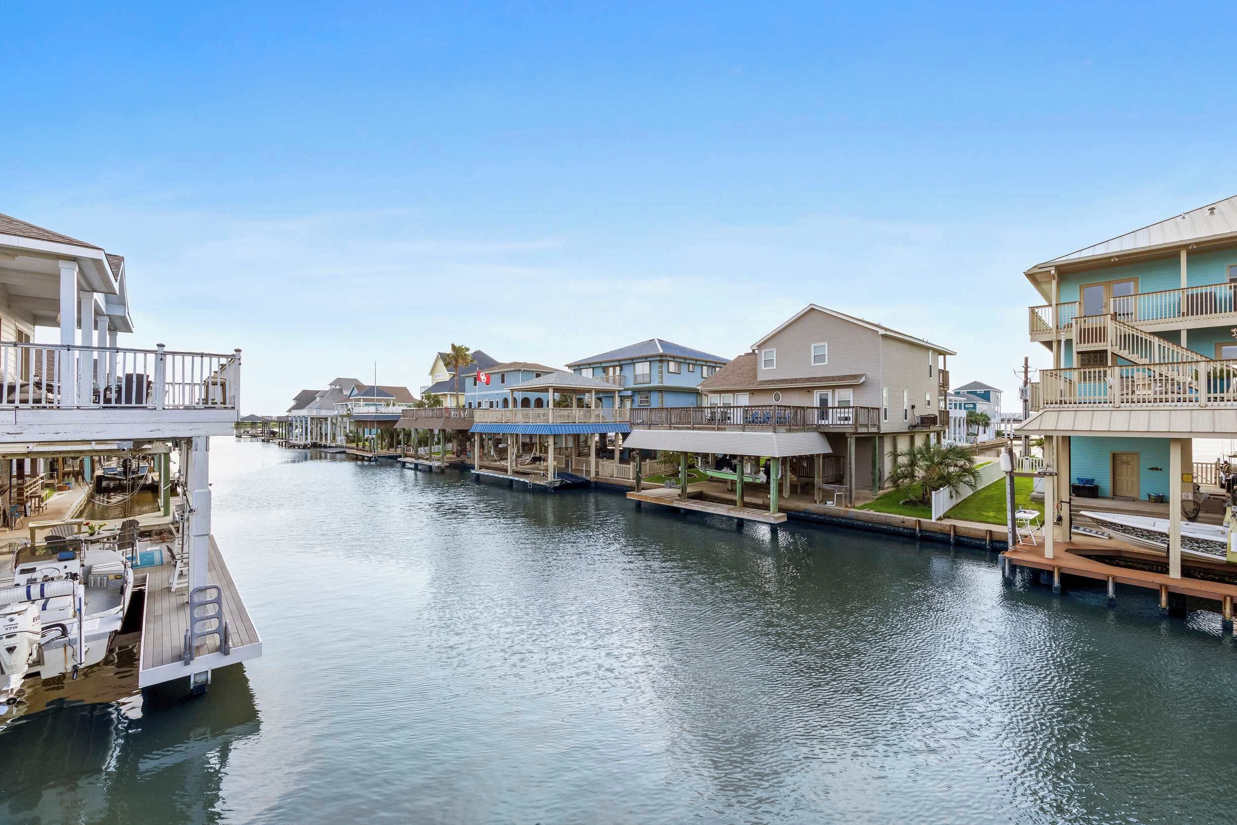A waterfront property with multiple buildings, docks, and boats.