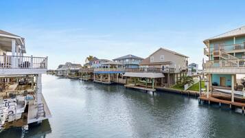A waterfront property with multiple buildings, docks, and boats.