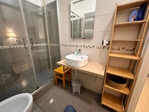 Hair dryer, bidet, towels, soap