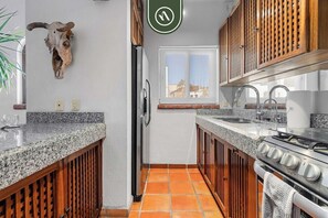 Apartment, Multiple Beds, Jetted Tub, Ocean View (Selva Romantica Safari 2) | Private kitchen - Stylish 2 BR Condo in Romantic Zone - Rooftop Pool (Puerto Vallarta)