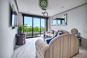 Apartment, Multiple Beds, Balcony, City View (Quadrant 2205) | Living area | 42-inch flat-screen TV with digital channels