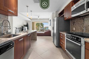 Apartment, Multiple Beds, Kitchen, Ocean View (DelCanto TA303) | Private kitchen - Oceanfront 2 BR Condo - Beach - Restaurant - Gym (Nuevo Nayarit)