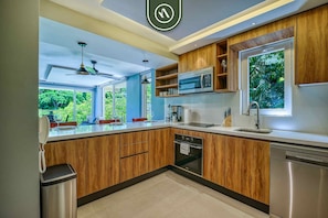 Apartment, Multiple Beds, Kitchen, Ocean View (Sea View Residences 302) | Private kitchen | Dining tables