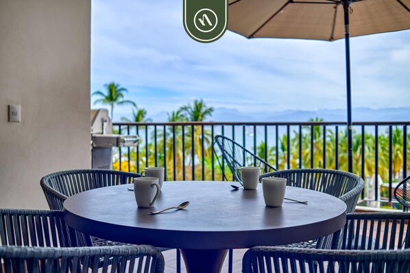 Apartment, Multiple Beds, Kitchen, Ocean View (The Canuva Lux 204) | Outdoor dining