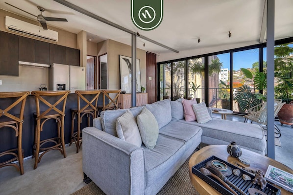 Apartment, 1 King Bed, Fireplace, Beach View (Casa Lucas PH) | Living area | 42-inch flat-screen TV with digital channels, fireplace