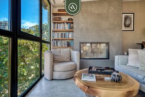 Apartment, 1 King Bed, Fireplace, Beach View (Casa Lucas PH) | Living area | 42-inch flat-screen TV with digital channels, fireplace