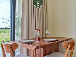 Apartment, 1 King Bed, Kitchen, Pool View (Residences by Mio) | Dining