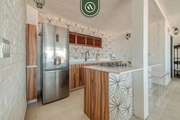 Apartment, Multiple Beds, Kitchen, Ocean View (Sagitario 120 U1) | Private kitchen | Coffee/tea maker, dining tables