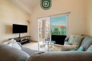 Apartment, Multiple Beds, Kitchen, Pool View (Diamante Lakes 323) | Living area