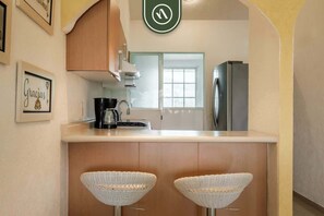 Apartment, Multiple Beds, Kitchen, Pool View (Diamante Lakes 323) | Private kitchen | Dining tables - 2BR Condo in Acapulco With Private Patio - Pool (Acapulco)