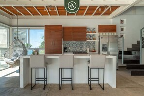 Apartment, Multiple Beds, Hot Tub, Ocean View (The Ava 14) | Private kitchen | Dining tables