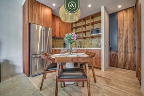 Studio Suite, 1 King Bed, Balcony, City View (Nomada 5D) | Private kitchen | Dining tables - Luxury Studio in Romantic Zone - Infinity Pool (Puerto Vallarta)