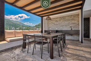 Departamento, 1 cama Queen size, hidromasaje, vista al océano (Madero 320 B103) | Restaurante al aire libre
