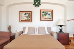 Apartment, Multiple Beds, Balcony, Ocean View (One Beach Street 104 A) | 2 bedrooms, individually decorated, individually furnished, bed sheets