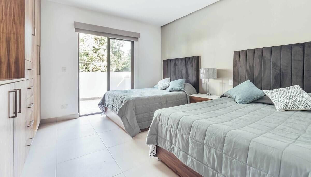 Condo, Multiple Beds, Pool Access, Beach View (DellaTerra 1A) | 2 bedrooms, individually decorated, individually furnished, bed sheets