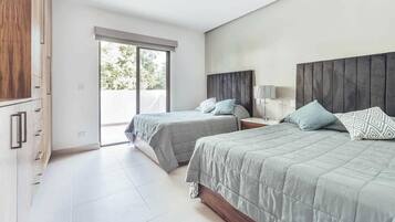 Condo, Multiple Beds, Pool Access, Beach View (DellaTerra 1A) | 2 bedrooms, individually decorated, individually furnished, bed sheets
