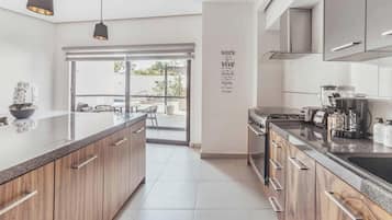 Condo, varias camas, acceso a la alberca, vista a la playa (DellaTerra 1A) | Cocina privada