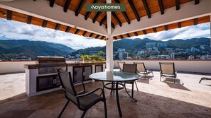 Departamento, varias camas, cocina, vista al océano (305-VistadelSol) | Restaurante al aire libre